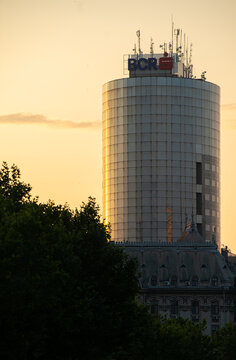 Headquarters office building of BCR bank from Romania. Photo taken in Bucharest, 2021, during a summer sunrise.