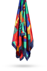 Subject photo of a bright scarf with a colorful geometric design. The stylish silk neckerchief is hanging on the white background.  