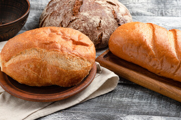 Italian ciabatta, rye bread, baguette on wooden background, white background