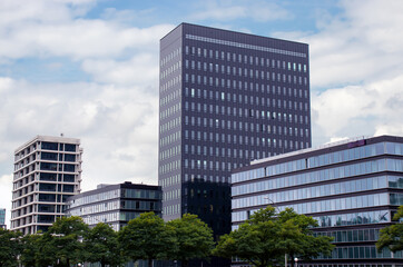 New building in Hamburg. residential area in the City. Modern architecture. Multi-story houses. Office Building. Rent an apartment. Real estate investment.