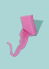 Violet sponge melting concept with slime on a pastel blue background. Immersive reality conceptual...