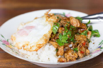 Rice topped with stir-fried pork and basil