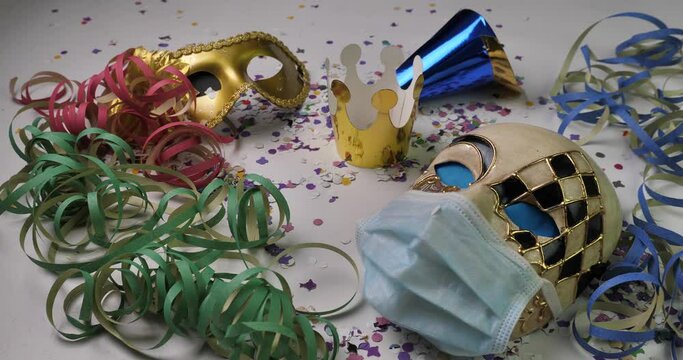 Carnival masks with streamers and surgical mask at the time of Covid-19