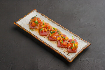 sashimi with salmon or tuna on a black background