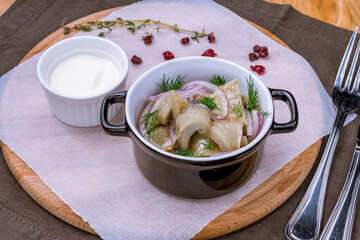 milk mushroom salted on a plate with sour cream