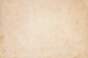 Old yellowed kraft paper with stain dots