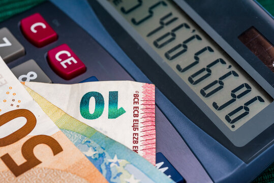 Euros on calculator. Macro photo.