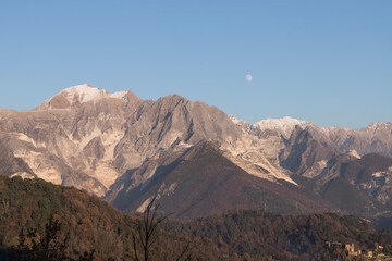 Carrara's side of the Apuan Alps with marble quarries; the Apuan Alps (Alpi Apuane in Italian) are a mountain range in northern Tuscany in Italy, known for its Carrara Marble - 480192469