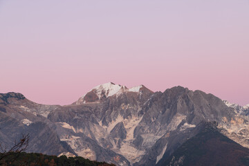 Carrara's side of the Apuan Alps with marble quarries; the Apuan Alps (Alpi Apuane in Italian) are a mountain range in northern Tuscany in Italy, known for its Carrara Marble - 480192473