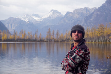 Hiker at the Kodar ridge and mountain lake