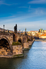 Fototapeta na wymiar Prague in the morning, Charles Bridge reflected in the Vltava river