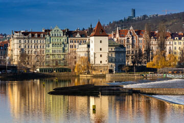 Fototapeta na wymiar Prague in the morning, cityscape, reflection of buildings in the Vltava river