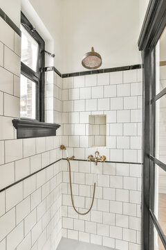Interior of cabin with tiled walls and shower sets