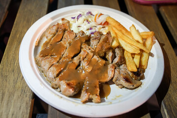 Steak and french fried food street by foodtruck, Bangkok, Thailand.