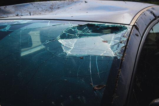 Broken windshield. Car dent in. Car crash.