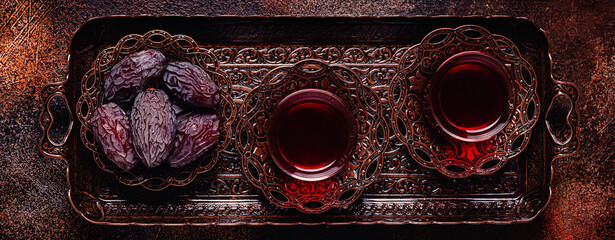 Dried dates fruit with Turkish tea. Popular fruit of Ramadan.