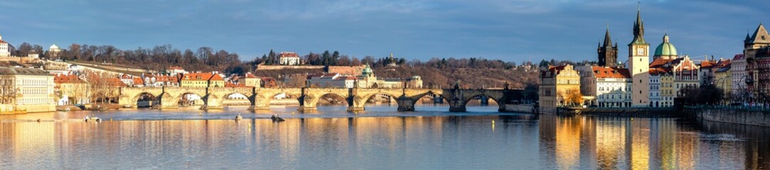 Fototapeta na wymiar Prague in the morning, Charles Bridge against the blue sky, cityscape, panoramic shot