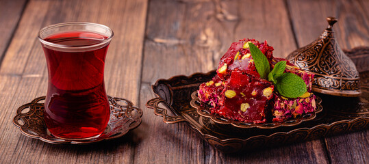 Traditional Turkish Delight with glass of tea