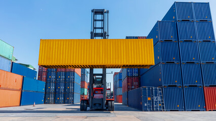 forklift working in the container cargo yard port loading cargo tank  logistic service and transportation concept.