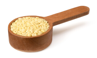 Hulled hemp seeds in the wooden spoon, isolated on white