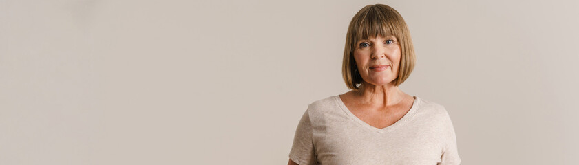 Senior woman wearing t-shirt posing and looking at camera