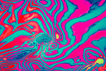 Abstract trendy neon colored psychedelic fluorescent striped zebra color waves textured neon background. 1960s Style Color Waves backdrop