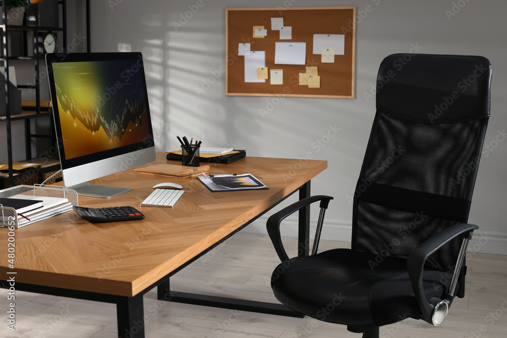 Poster computer with graph on table in office
