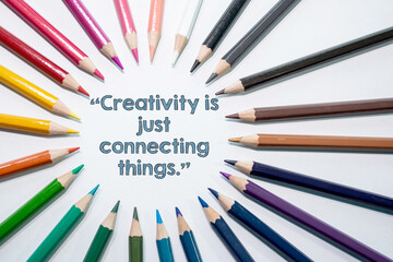 Creativity is just connecting things, Motivational quote on white background with color pencil  