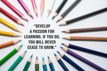Develop a passion for learning. If you do, you will never cease to grow. Motivational quote on white background with color pencil  