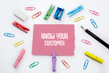 Text sign showing Know Your Customer on Set of colorful paper clips with white copy space background