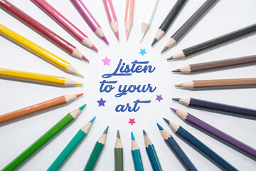 Text sign showing Listen to your art motivational creative quote on color pencil arranged in circle background.