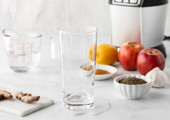 Ingredients surrounding blender for preparing a detox smoothie.