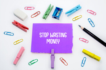 Text sign showing Stop Wasting Money