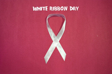 White Ribbon Day Symbol, isolated on red  background