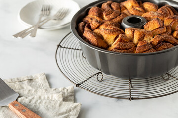Homemade apple cinnamon monkey bread in a bundt pan, fresh out of the oven. 