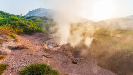 Steaming, sulfuric, active fumaroles near Pauzhetskaya Geothermal Power Plant, Kamchatka Peninsula,...