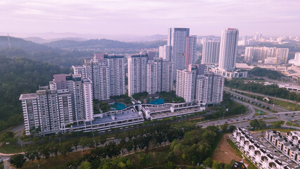 An aerial view of luxury highrise residential condominium neighbourhood during sunrise