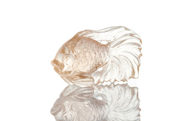 beautiful figurine fish made of topaz on a white background