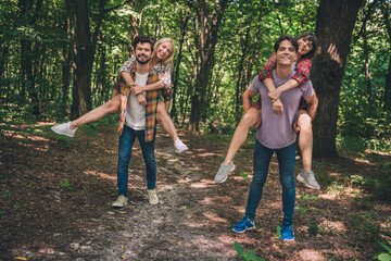 Photo of four people couple happy positive smile have fin piggyback forest trees nature hiking...