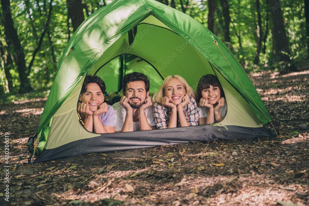 Sticker Photo of best friends happy positive smile lying camp hands touch cheeks expedition extreme nature forest trip outdoors