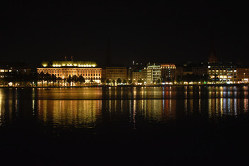 Fototapeta na wymiar Hamburg at night with reflection in the water