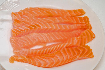 Fresh raw salmon strips