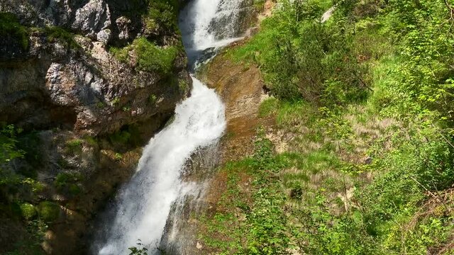 Amazing landscape with Lainbach waterfall in summer, very close to the bavarian town of Mittenwald in Germany