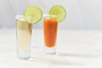 Tequila shot with sangrita and tequila shot. Mexican appetizer for tequila.