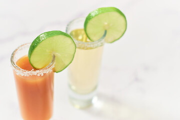Tequila shot with sangrita and tequila shot. Mexican appetizer for tequila.