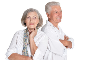 happy beautiful senior couple huging and posing on white background