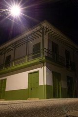 Jardin, Antioquia, Colombia.  March 16, 2020: Colonial architecture at night and colorful facades.