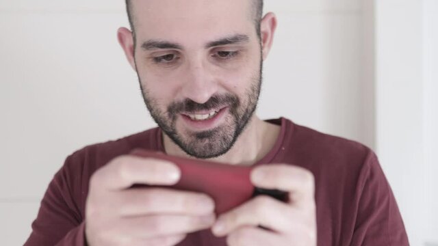 Point of View Shot Man Playing Game on his Smartphone. Cyber Gaming concept