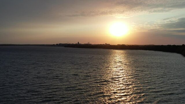 Sunset over Lake Monona in Madison Wisconsin - Downtown in Distance (Drone - Low To High)