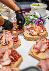 Chef hand is in process of Preparing catering food